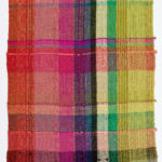 A ten foot length of plaid, woven fabric in the bright colors of the rainbow.