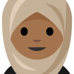A medium-dark skin tone emoji depicting a smiling woman from the shoulders up wearing a black shirt and a tan headscarf.