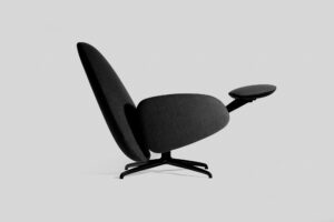 A modern recliner chair with soft round features, all dark grey with a black base.