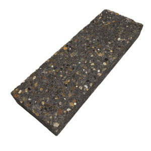A single rectangular dark brown brick sprinkled with different stone flecks throughout.