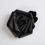A black rose made of fabric