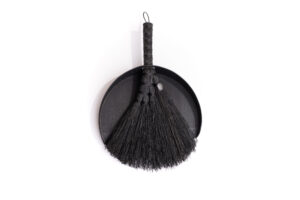 Black wooden dustpan and brush set.
