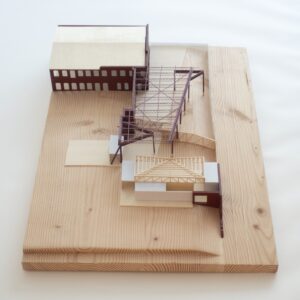 Neat rectangular wooden model of Monospace with visible woodgrain.