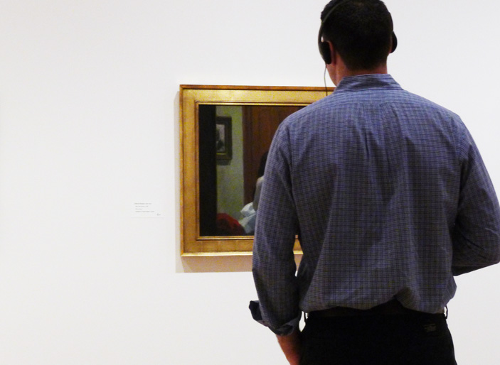 visitor looking at a painting