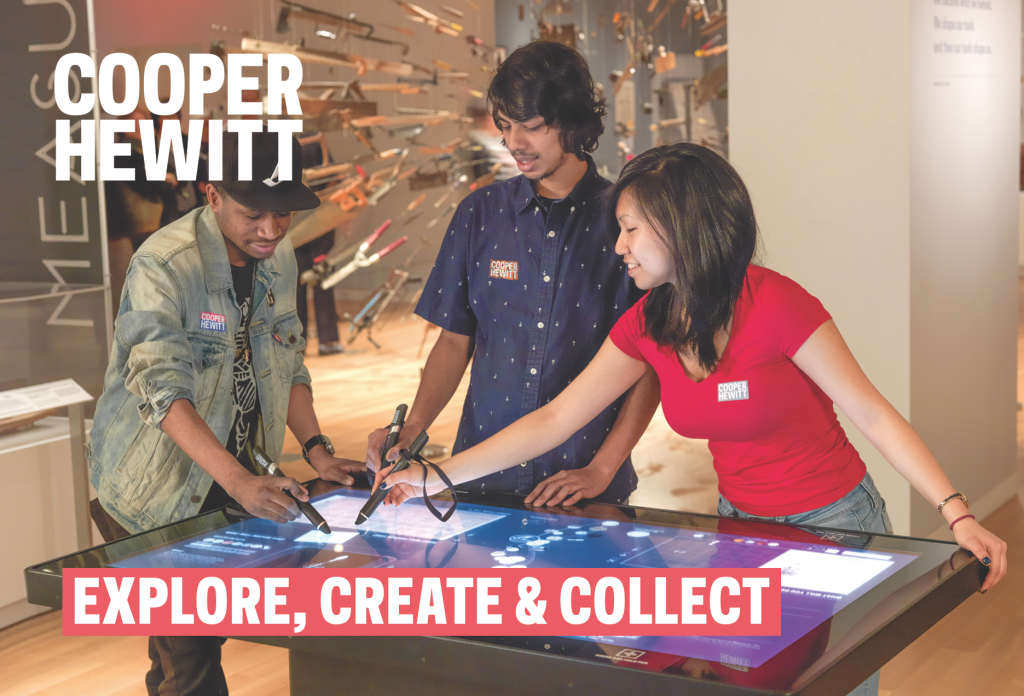 three young people in a museum setting holding large black wands and pressing them to a touchscreen glass tabletop