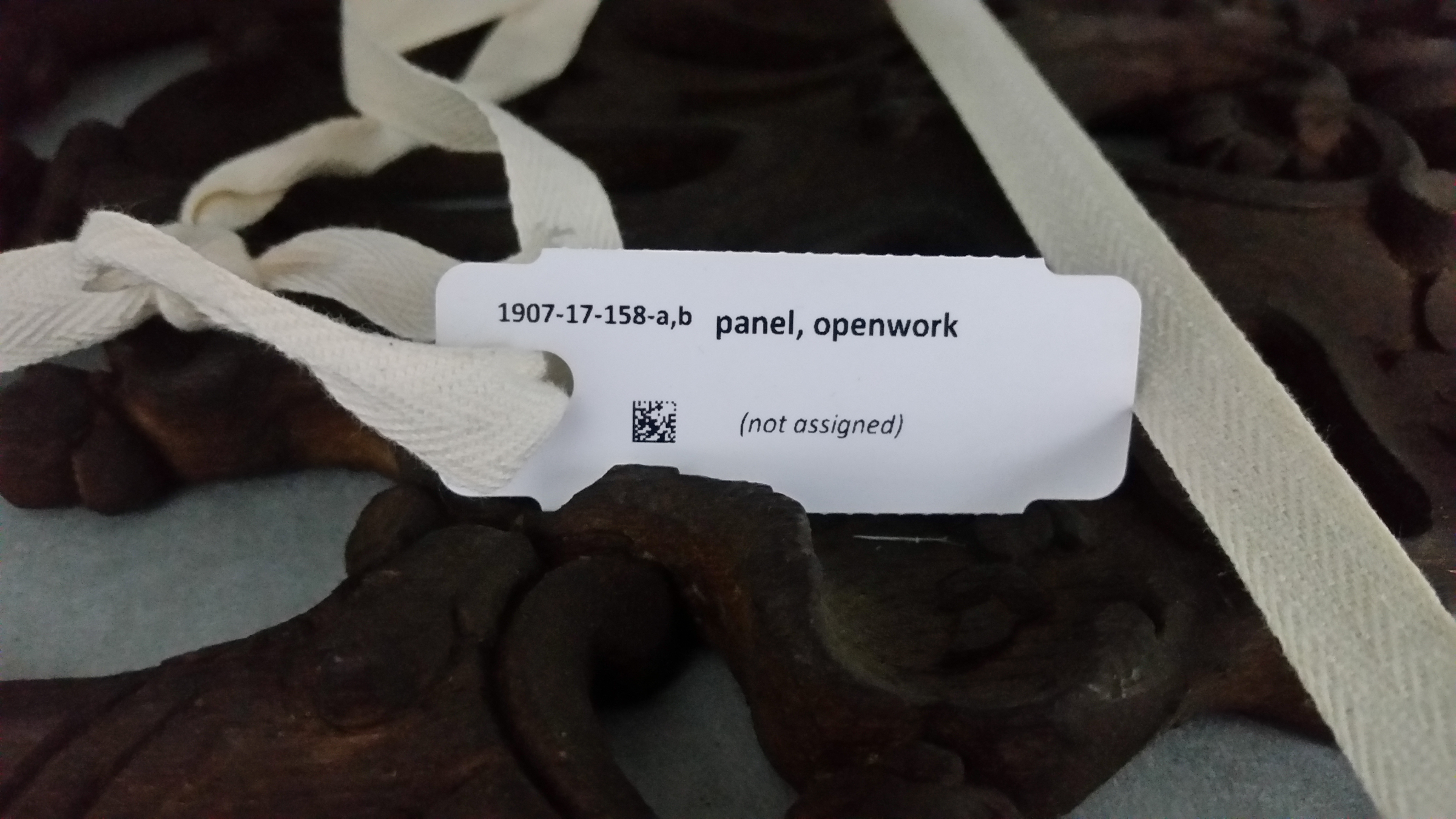 A barcode tag attached to an object in the metalwork sub-collection.
